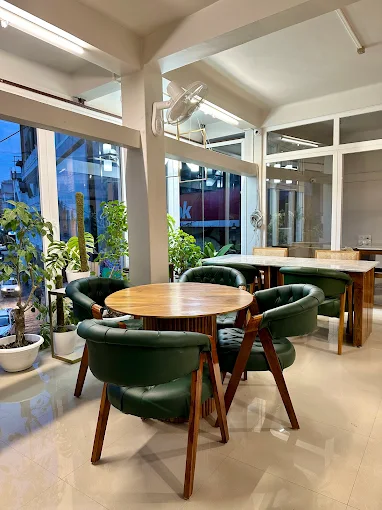 Café seating with wooden chairs and evening ambience
