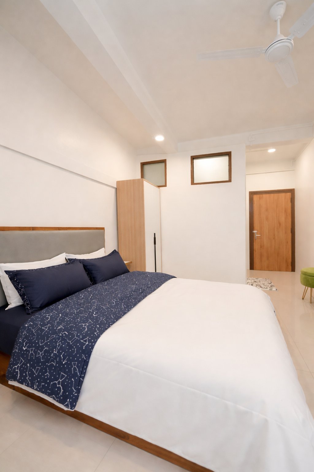 Signature Room — bed with wardrobe and en-suite access